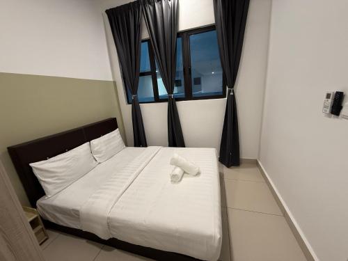 Ένα ή περισσότερα κρεβάτια σε δωμάτιο στο Trion KL Residence By CozyNest