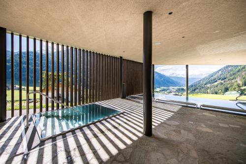 a house with a view of the mountains at Mountain Residence Montana in Santa Maddalena in Casies