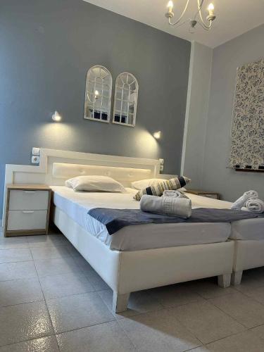 a bedroom with a large bed in a room at IVAS Pelion in Agios Ioannis Pelio