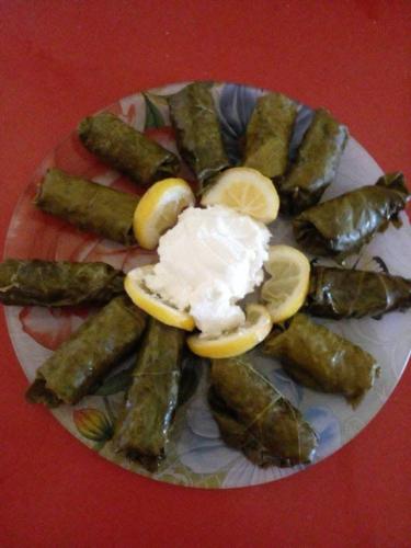 a plate of food withitizers and lemon slices on a table at Hovk Guesthouse in Hovkʼ