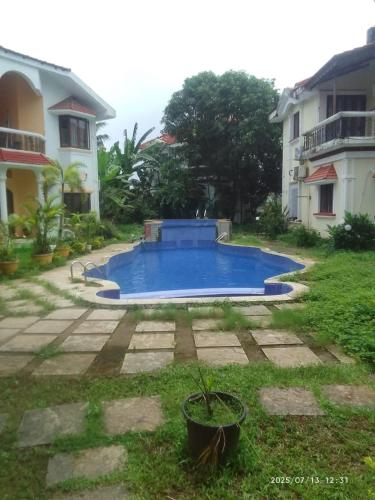 Πισίνα στο ή κοντά στο Ronne's 3BHK MEADOWS VILLA
