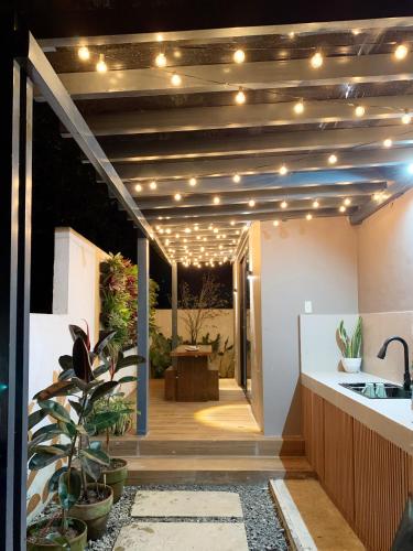 a room with a kitchen with lights on the ceiling at Madria Loft Cabin in Baras