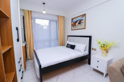 Ένα ή περισσότερα κρεβάτια σε δωμάτιο στο Smart Homes Apartment