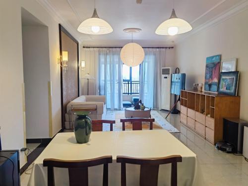 a large living room with a table and chairs at M Panda Tower Boutique Chengdu in Chengdu