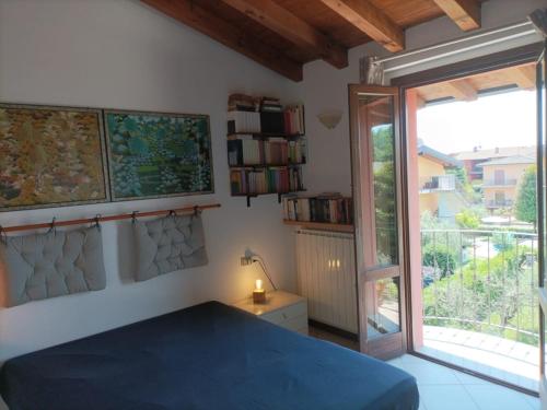 Ένα ή περισσότερα κρεβάτια σε δωμάτιο στο Lakeview Dream Veranda Sul Lago