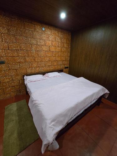 Ένα ή περισσότερα κρεβάτια σε δωμάτιο στο Elysium Vista Home Stay