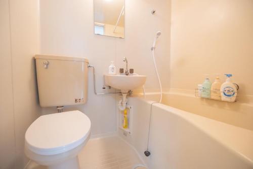 a bathroom with a toilet and a sink at XLH2,7 Min by Train to Harry Potter Studio Tour, Quick Access to Shinjuku, Double Bed and Sofa Bed, Private Kitchen and Living Room, Sleeps 4 in Tokyo