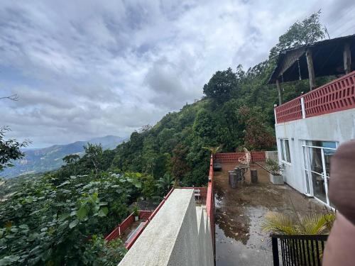 a view of a mountain from a house at Happiness Hill house in Rikillagaskada