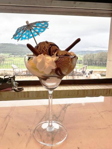 a dessert in a wine glass sitting on a table at La Quinta Luxury Palace in Arnuero