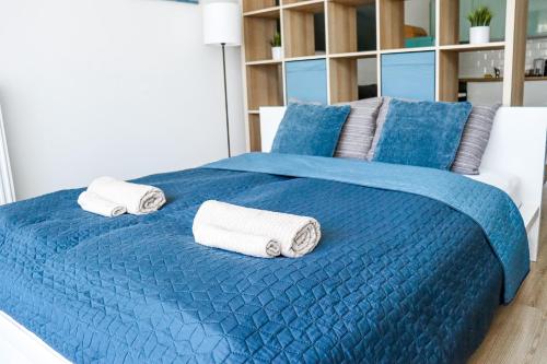 Rúm í herbergi á Panoráma Sétány Apartman Fonyód