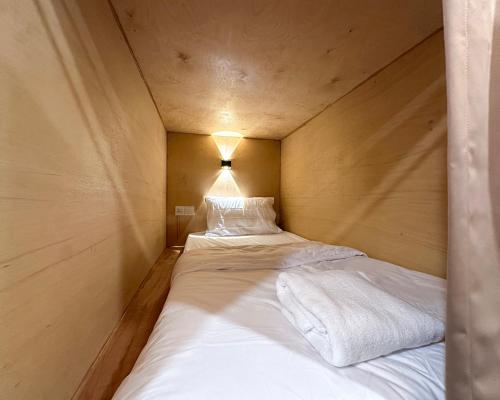 a couple of beds in a small room at Toh Aka Inn in George Town