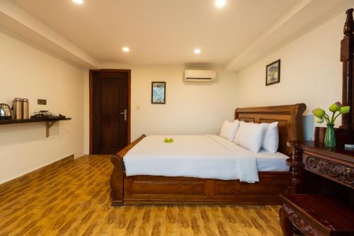 Ένα ή περισσότερα κρεβάτια σε δωμάτιο στο Stay Siem Reap