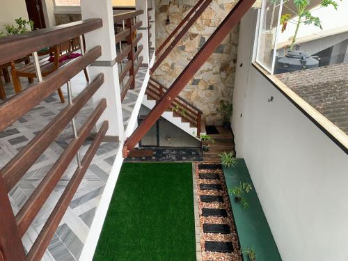 an internal view of a house with a green lawn at Rodrigo Beach Villa in Uswetakeiyawa