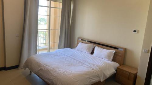 Postel nebo postele na pokoji v ubytování شقق التجوري Al-Tjouri Apartments