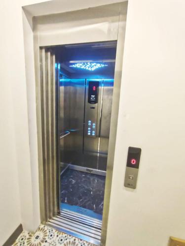 an elevator in a building with a door open at Taksim Millennium Alkan Residence in Istanbul