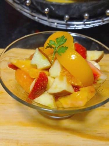 a glass bowl filled with fruit on top of a table at Likhanyile Guest Lodge in Nhlangano