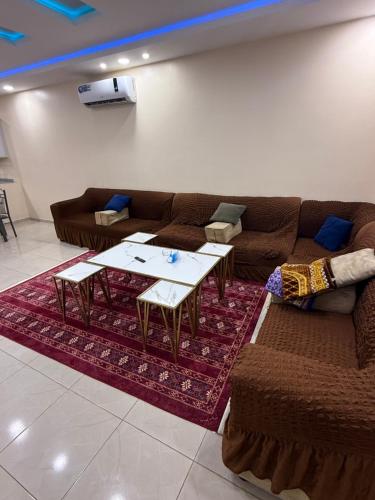 a living room with a couch and a table at شاليهات زارا Zare in Taif