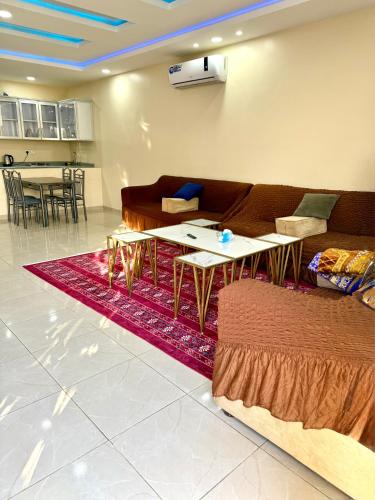 a living room with a couch and a table at شاليهات زارا Zare in Taif