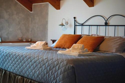 a bed with towels and pillows on top of it at San Giacomo Relais in Furore