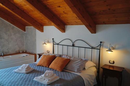 a bedroom with a bed with two towels on it at San Giacomo Relais in Furore