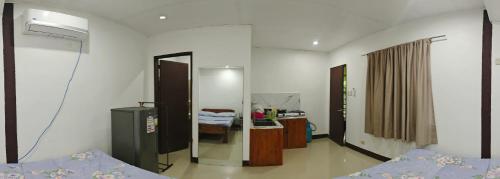 a hospital room with a bed and a mirror at Hola El Nido in El Nido