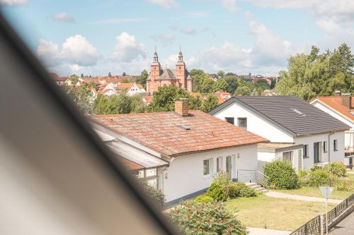 a view from a window of a white house at WHONAP - BLUVYN I Business I Parkplatz I Balkon I Natur in Walldürn