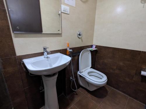 Ένα μπάνιο στο AVM Comforts Inn Koramangala