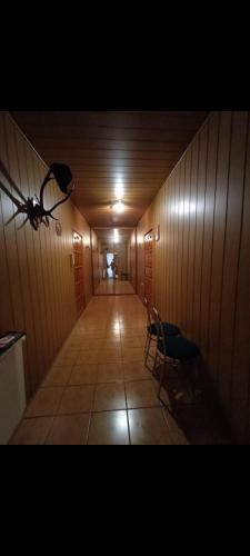 a hallway with a room with a table and chairs at Apartament u Marcina in Borne Sulinowo