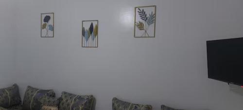 a living room with a couch and a tv at Entire rental unit in Tangier, Morocco in Tangier