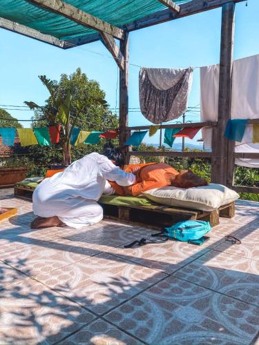 two men are sleeping on beds under a pavilion at Pilgrims Rest - Vila Nova de Cerveira - Hostel - Albergue - AL in Vila Nova de Cerveira