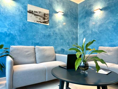 a living room with a couch and a table at Serpa Hotel in Anzio