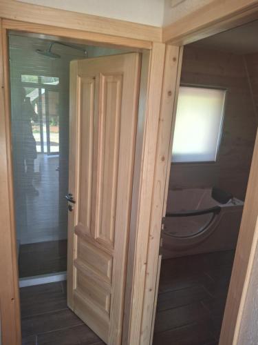 an open door to a room with a bed at Spa villas Higo in Žabljak