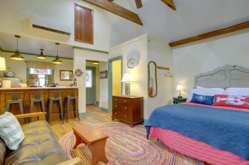 a bedroom with a king sized bed and a kitchen at Walk to Park and River Dog-Friendly Cambridge Gem in Cambridge