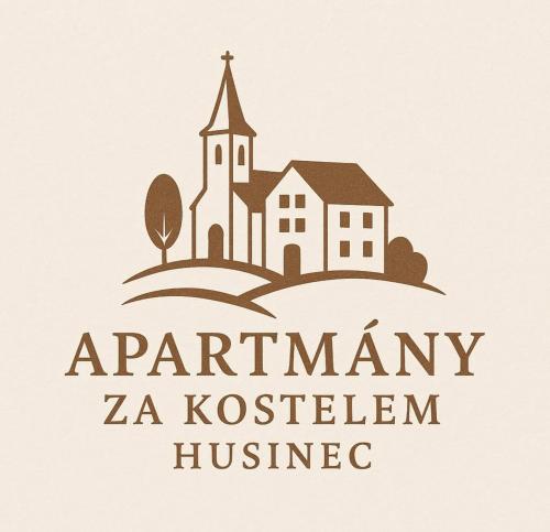 a church and a house with a cross on top at Apartmány za kostelem in Husinec