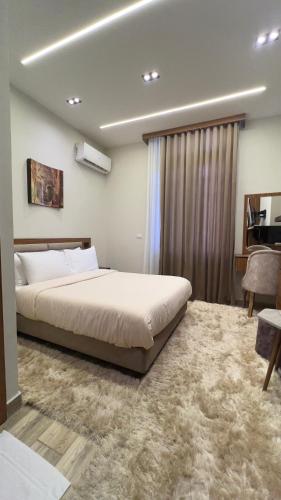 a bedroom with a large bed in a room at Italia Hotel cairo in Cairo