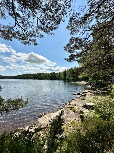 a view of a body of water with trees at Ljungskile Hotell & Konferens in Ljungskile