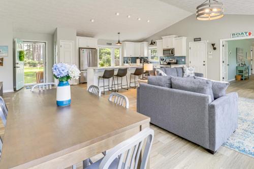 a kitchen and living room with a table and chairs at Boat Dock and Kayaks Waterfront Home in Deltaville! in Deltaville