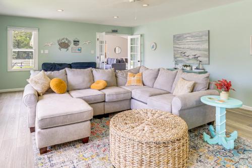 a living room with a couch and a table at Boat Dock and Kayaks Waterfront Home in Deltaville! in Deltaville