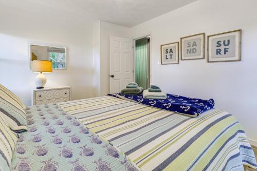 a bedroom with a bed with towels on it at Boat Dock and Kayaks Waterfront Home in Deltaville! in Deltaville