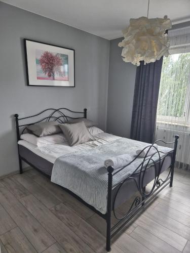 Postel nebo postele na pokoji v ubytování Milanos apartament