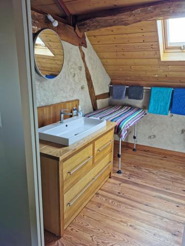 a bathroom with a sink in a cabin at Au cordonnier in Troncens