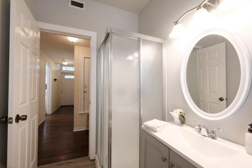 a bathroom with a sink and a mirror at 438M- 3 BR Apt with Free Parking on Premises and Coffee in San Antonio