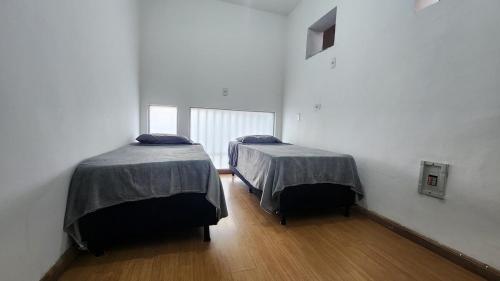 Voodi või voodid majutusasutuse Casa para até 16 pessoas no Lurdes, perto da Savassi BH toas