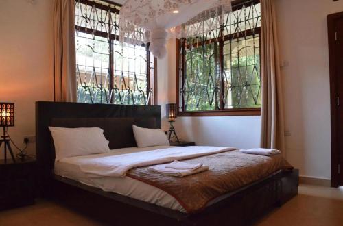 Ένα ή περισσότερα κρεβάτια σε δωμάτιο στο Barazani Garden House