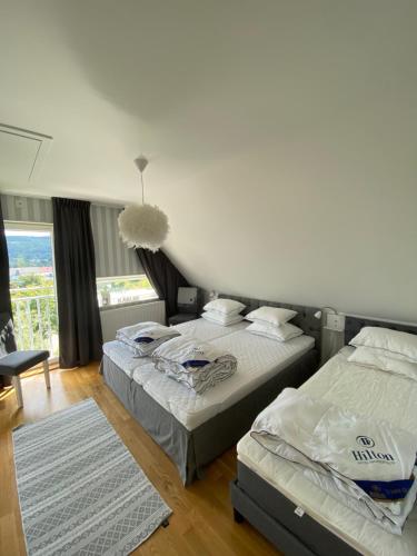 En eller flere senge i et værelse på Holiday home Båstad, 8 beds