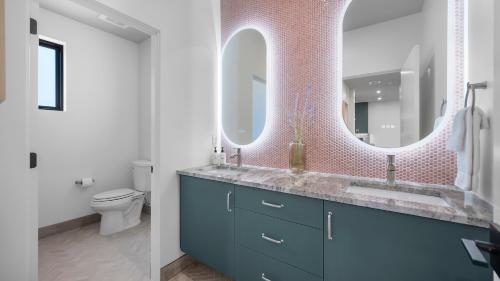 a bathroom with a blue sink and a mirror at Montclair at Zion in Springdale