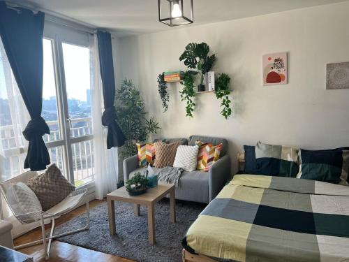 Χώρος καθιστικού στο Résidence cosy Paris sud