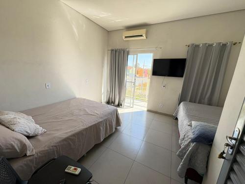 Katil atau katil-katil dalam bilik di Casa Temporada Aconchego e tranquilidade 2