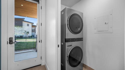 a washer and dryer in a room next to a door at Montclair at Zion in Springdale