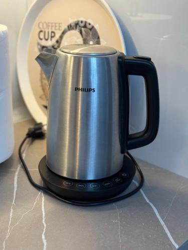 a coffee pot sitting on top of a counter at Royal Stay Apartment 1 min walk of city centre in Elbasan